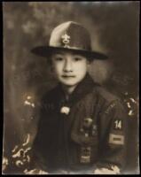 Gelatin silver photograph of a young Chinese in a Boy Scout Uniform