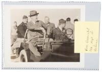 Photograph of Franklin D. Roosevelt and Dwight D. Eisenhower riding in a jeep at the Sicilian airport on December 8, 1943