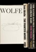 Three first editions by Tom Wolfe, including one signed