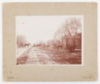 Street Scene, Stockton, California with men in 5 horse and buggy carriages