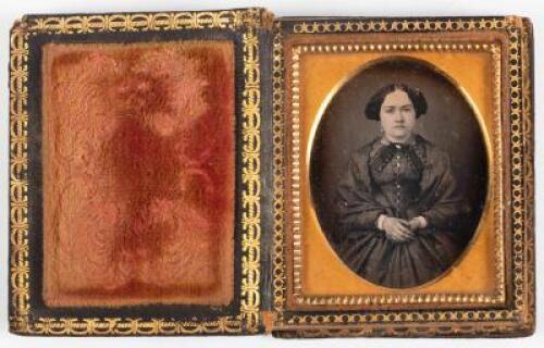 Ninth plate daguerreotype of woman seated with highlighting to dress buttons housed in a spray of flowers papier-mache case inlaid with mother-of-pearl.