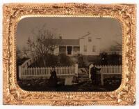 Tintype landscape of house with white picket fence and family in yard and street