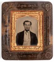 Ambrotype portrait of a gentleman in a jacket with string tie and fancy waistcoat, cheeks lightly tinted pink