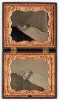 Two quarter plate baby post-mortem tintypes housed in double thermoplastic union case