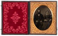 Tintype portrait of seated well dressed husband and wife