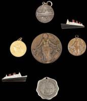 Five medals and two pins commemorating various ship lines