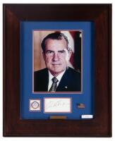 Framed color portrait with signature and campaign button