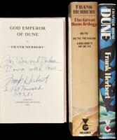 Three British editions of Dune books, each signed and/or inscribed by Frank Herbert
