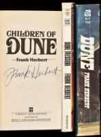 Paperback editions of the first three Dune titles, two of them signed