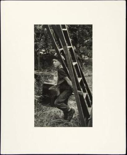 Untitled [Boy with a ladder, from Migrant Workers series]