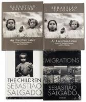 Four photography volumes by Sebasti&atilde;o Salgado