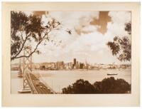 Oversize photograph of the San Francisco skyline from Yerba Buena Island, with the west half of the Bay Bridge in foreground