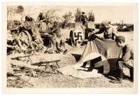 "Outfought Germans Lose Flags, Guns and Invincibility Myth" photograph and collection of British Air Ministry photographs related to Royal Air Force Bombings in Germany and Italy