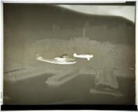19 negatives of photographs of a flying boat over San Francisco Bay