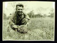 Photograph of Carl Thompson and a leopard, from Hemingway's 1933-34 African Trip