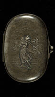 Silver soap holder with illustration of a lady golfer