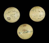 Three vintage golf balls, signed by golfers