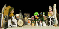 Golf collectibles and memorabilia including liquor bottles, toys, beer steins, salt and pepper shakers, and more