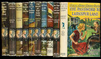 The first fifteen Nancy Drew titles, used in the filming of the opening sequence of the movie Nancy Drew: Mystery in the Hollywood Hills