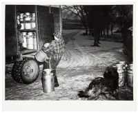 Milk man calls for the milk at Pat McRaiths farm about 7am, Meeker County, Minn.