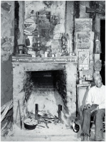 A fireplace in an old mud hut which was built and is still lived in by a French-mulatto family, near the John Henry plantation. Melrose, Louisiana