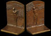 Pair of bronze bookends - coed pair of golfers, one on each bookend