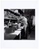 [Ed Ricketts holding jar of specimens at Pacific Biological Laboratories]