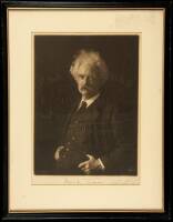 Photograph portrait of Mark Twain [Samuel L. Clemens], signed by him in ink beneath the image