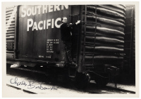 Photograph of Charles Bukowski and boxcar