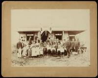 Albumen photograph of children and teachers standing in front of a Japanese school in Hawaii