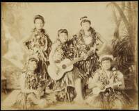 Albumen photograph of 5 female Hawaiian entertainers in hula dress, three with ukuleles
