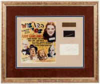 Piece of straw from the original scarecrow costume, framed with Ray Bolger's autograph