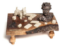 "Table of Contents" - mixed media sculpture of Mark Twain bust on a wooden tabletop