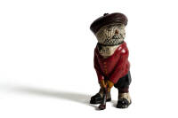 Cast iron figure of a golfer with a golf-ball movable head