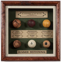 The Development of the Golf Ball: A Historic Record of Its Evolution - display case with 6 replica golf balls