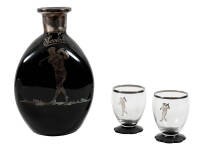 Black glass scotch decanter with silver onlay of an Art Deco style golfer, plus two glasses with silver onlay golfers