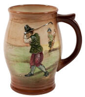 Earthenware mug with golfer decoration