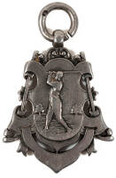 Silver golfing medal featuring a golfer flanked by golf clubs and balls