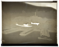 Twenty-two negatives of photographs of a flying boat over San Francisco Bay