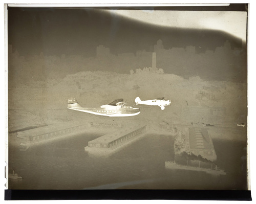 Twenty-two negatives of photographs of a flying boat over San Francisco Bay