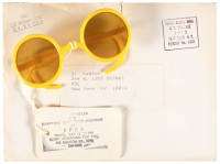 Sunglasses with invitation tag for event at NYC nightclub AREA