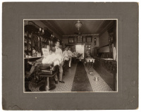Gelatin silver photograph of a Honolulu barber shop