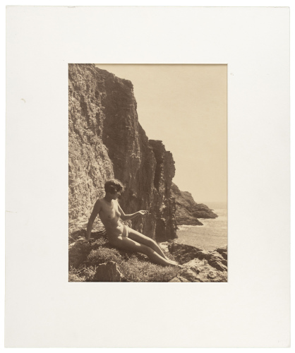 [Nude on rocky coast]