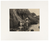 [Two nude figures on rocky coast]