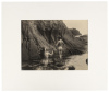 [Two nude figures on rocky coast]