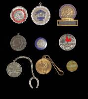 Eight metallic badges, etc., for various golf events from Helen Lengfeld
