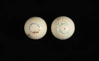 Two B.F. Goodrich Whippet triangle mesh golf balls