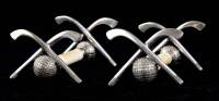 Pair of ivory and silver golf knife rests