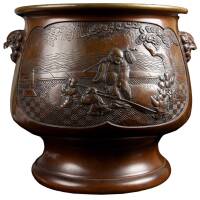Bronze Japanese Hibachi hand warmer with pictorial designs in relief