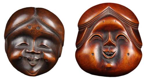 Two carved boxwood Japanese netsuke of masks